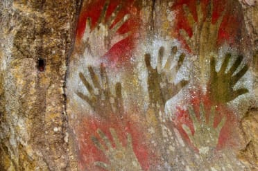 Human Interests represented in surrealistic cave wall markings.